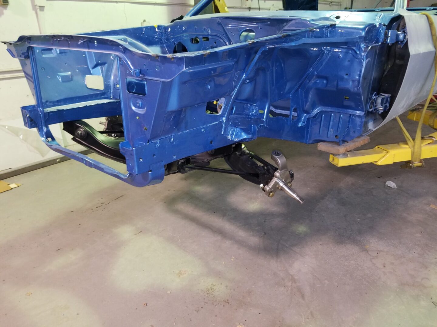 An empty blue car frame