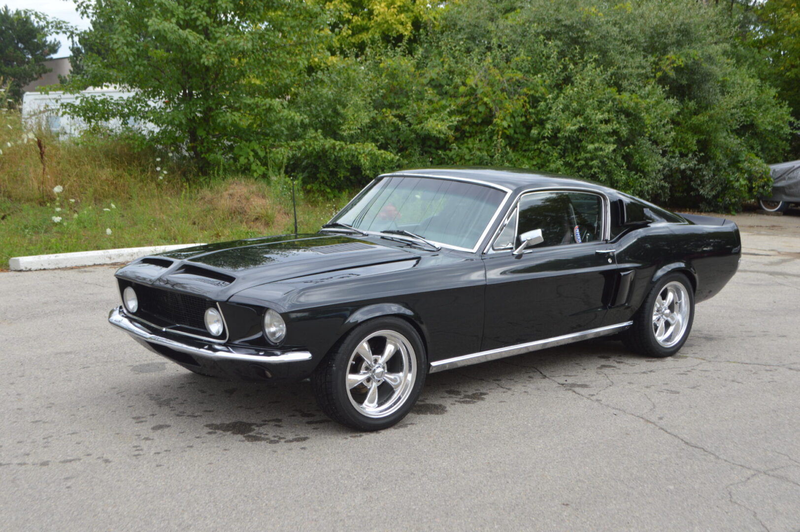 A black 1967 Mustang Fastback