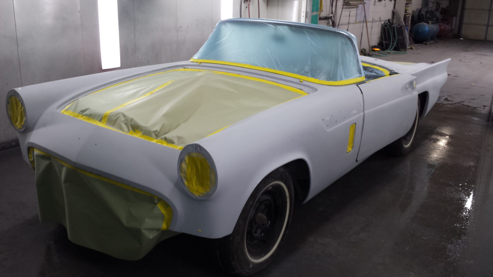 A 1957 Ford Thunderbird coated for darker paint