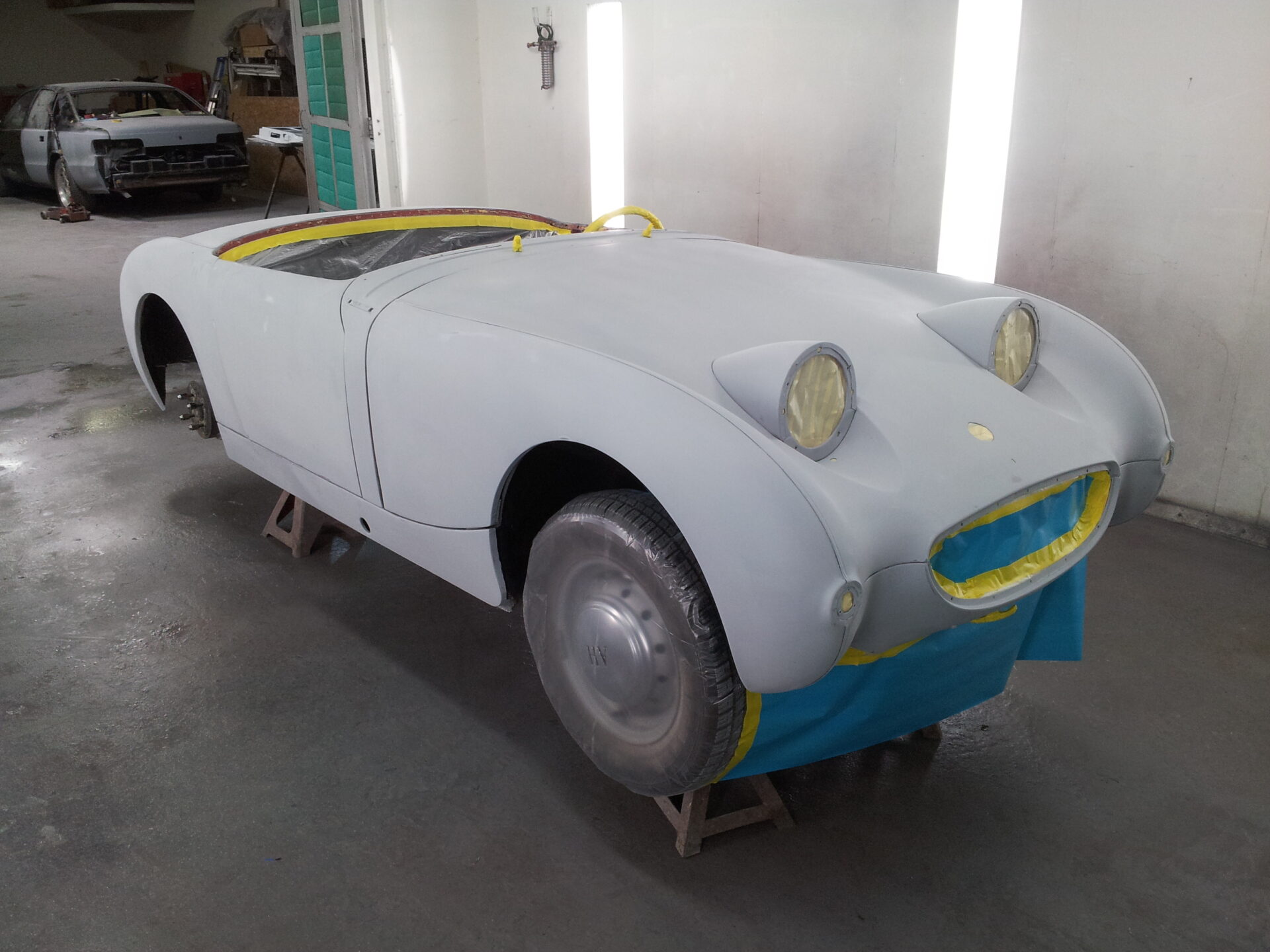 A partially assembled coated 1959 Austin Healey