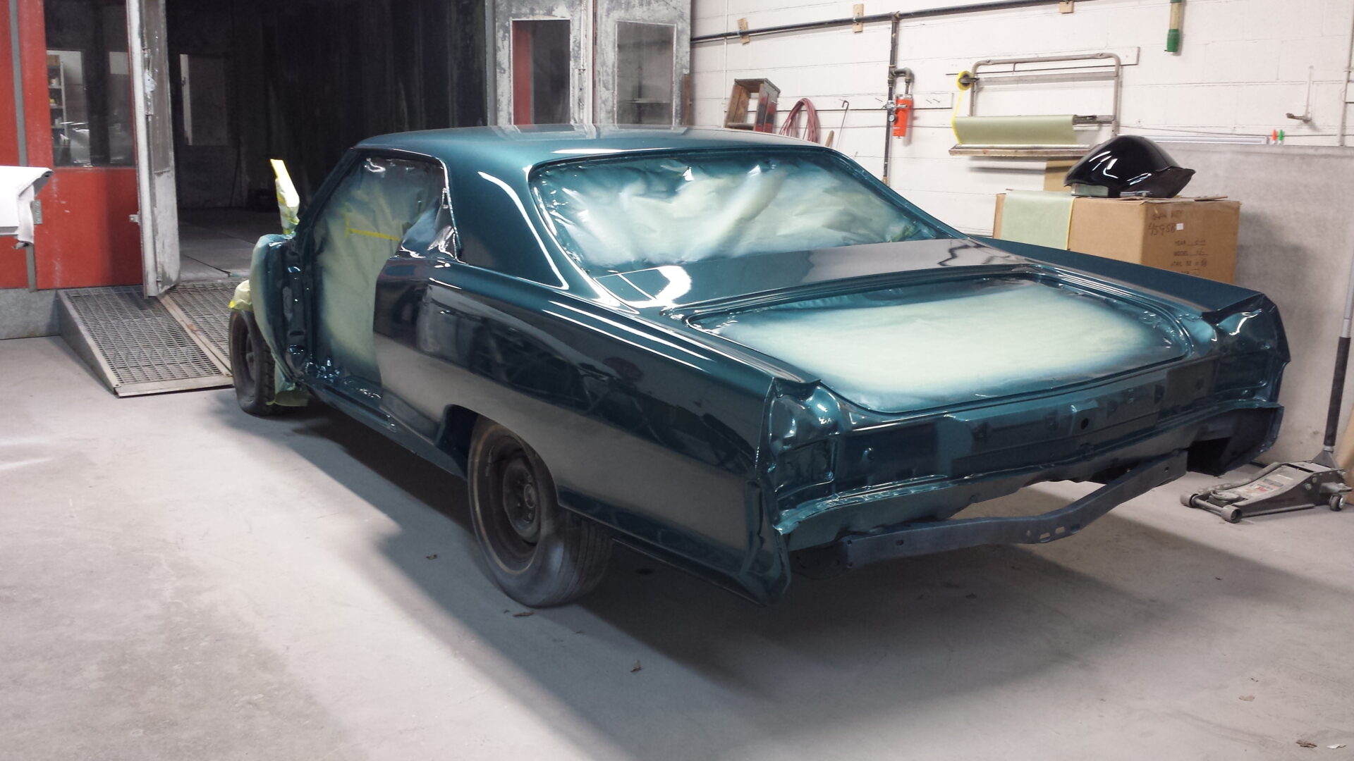 Surface of the 1965 Pontiac Grand Prix painted in blue green