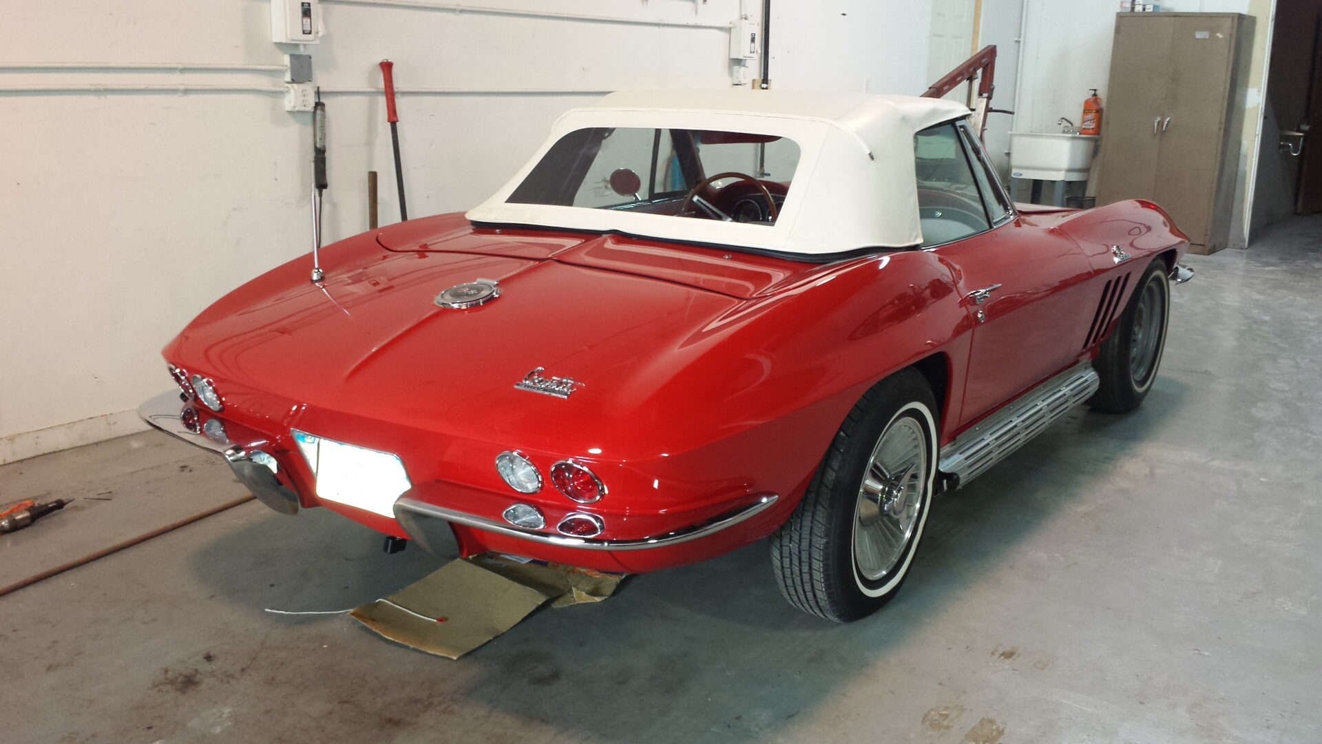 A rear view of the newly painted red 1966 Corvette
