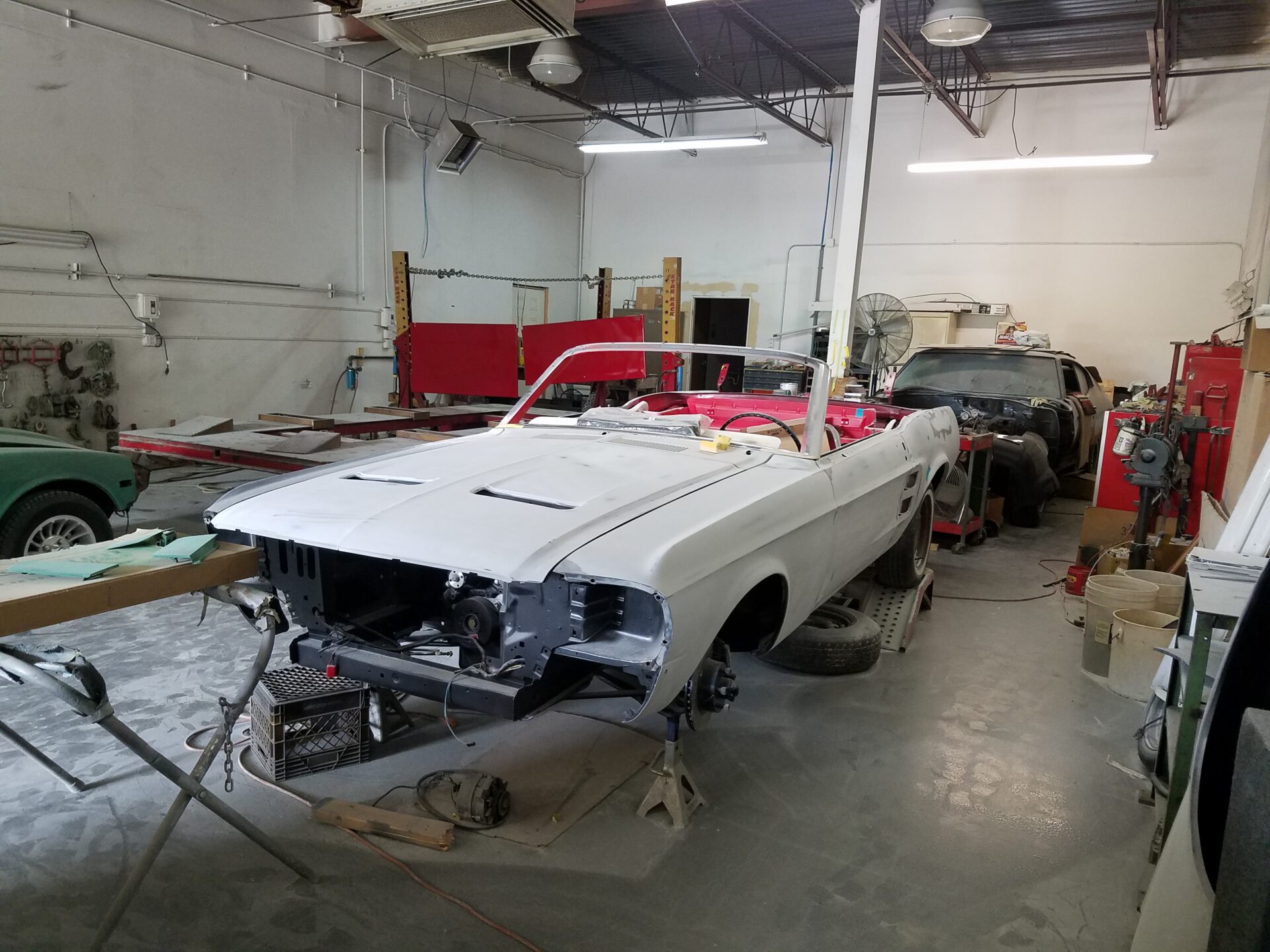 A 1967 Ford Mustang Convertible with ongoing repairs