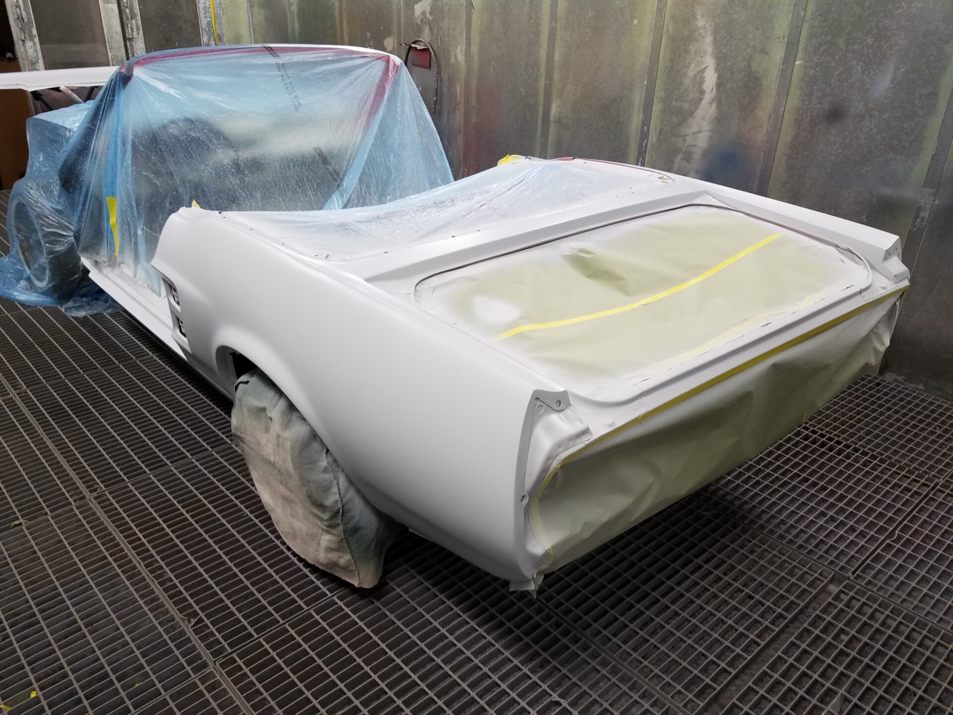 A newly painted white portion of the 1967 Ford Mustang Convertible