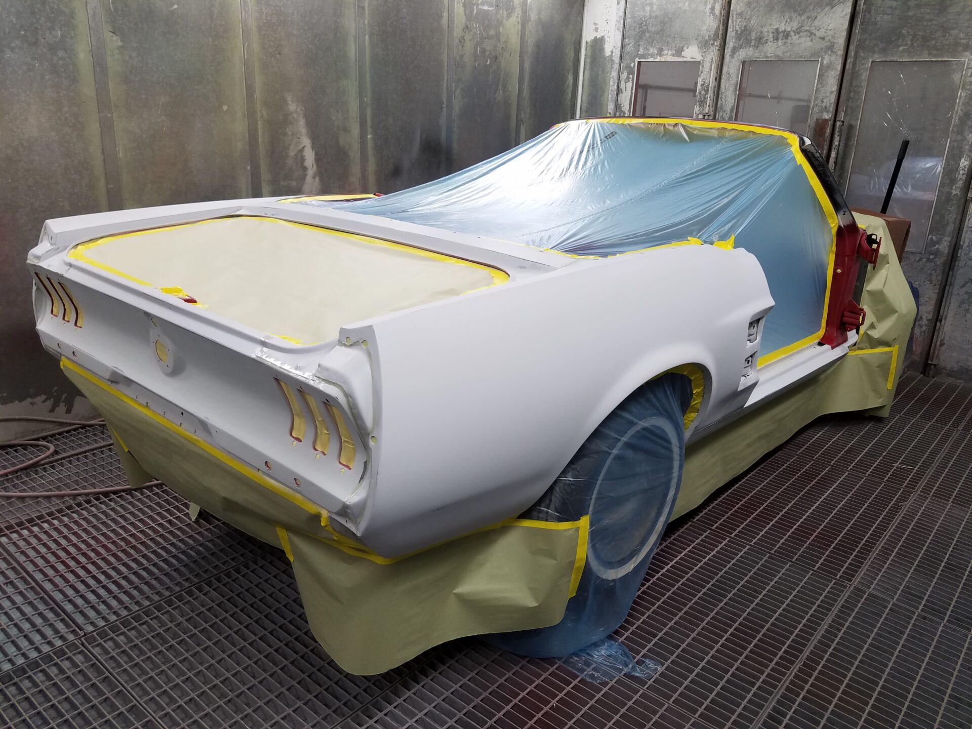 A white 1967 Ford Mustang Convertible car part