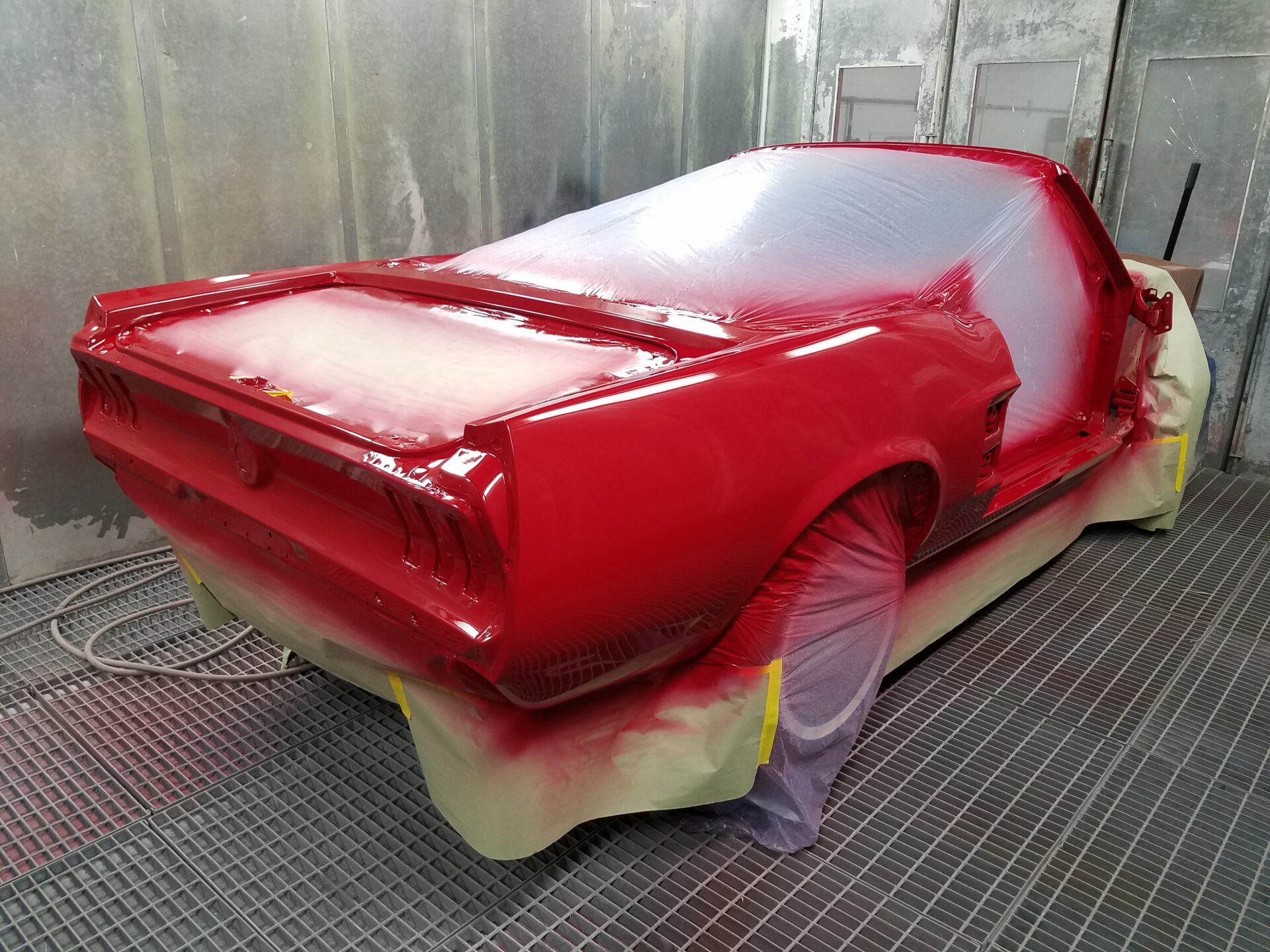 A newly painted red 1967 Ford Mustang Convertible
