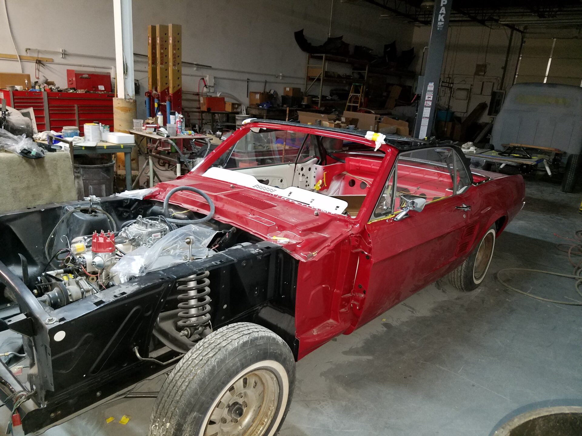 A 1967 Ford Mustang Convertible with partially completed parts