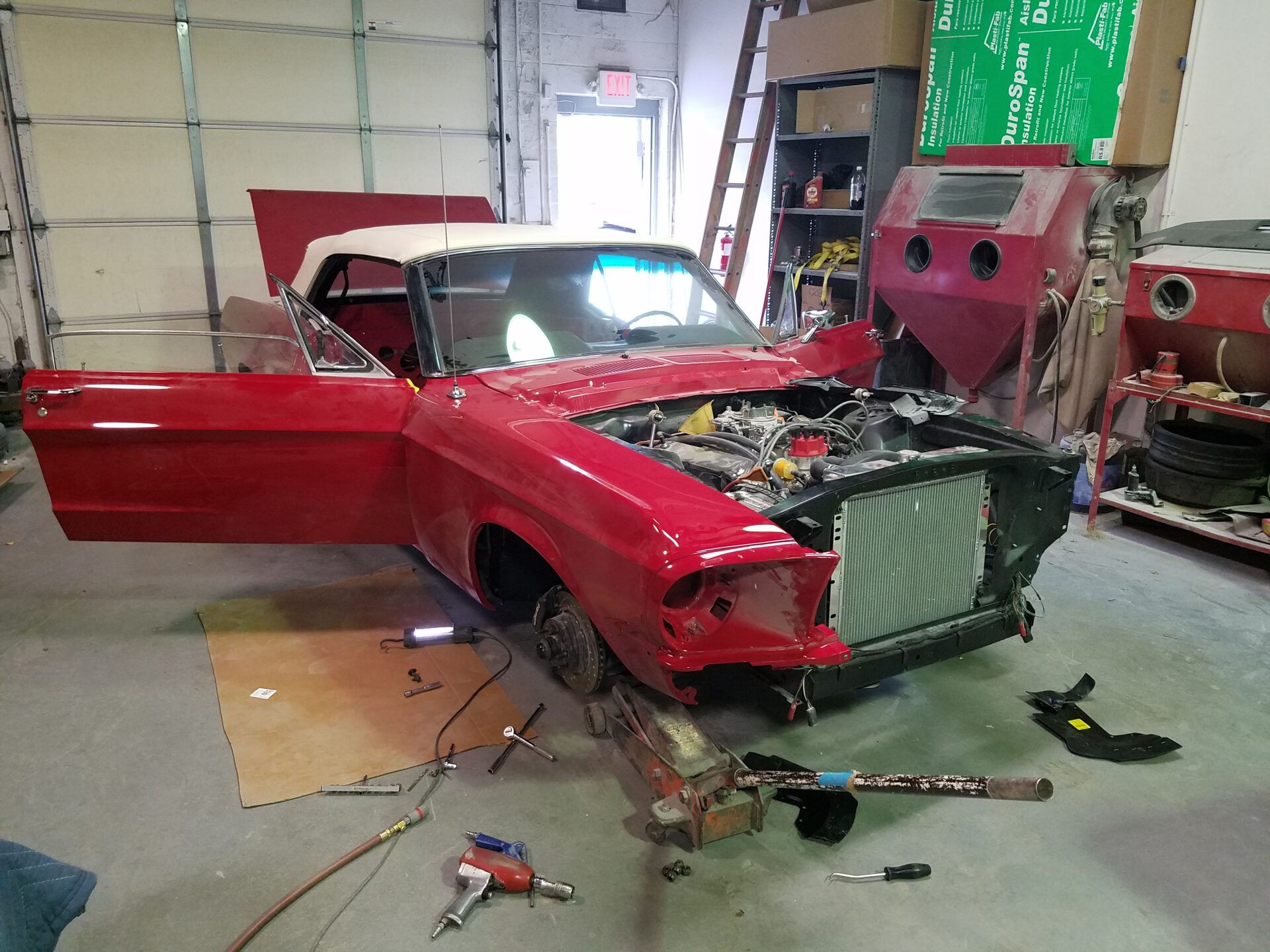 A 1967 Ford Mustang Convertible being reassembled