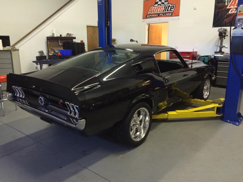 A black 1967 Ford Mustang Fastback restored