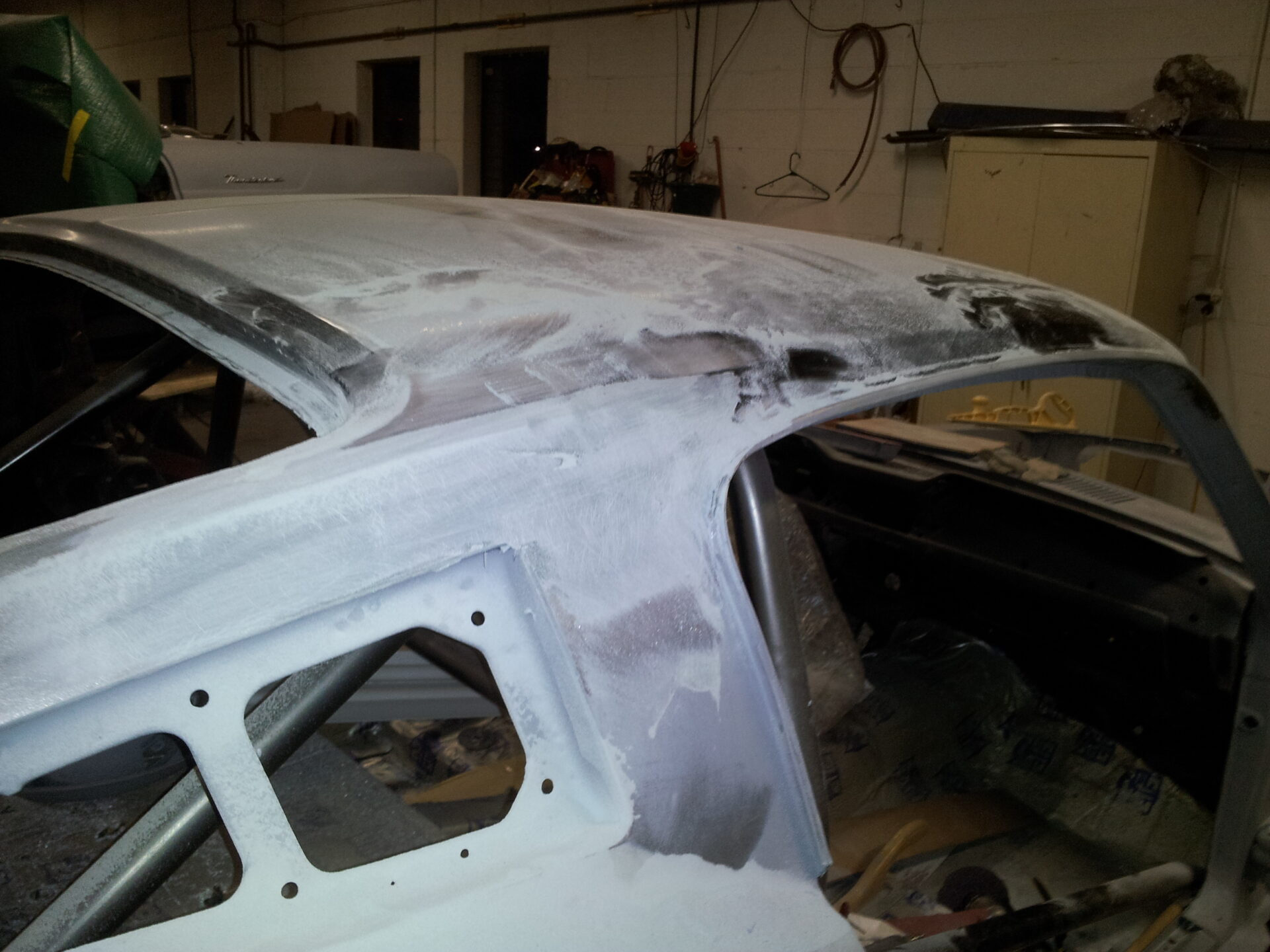 A 1967 Ford Mustang Fastback roof coated in white patches