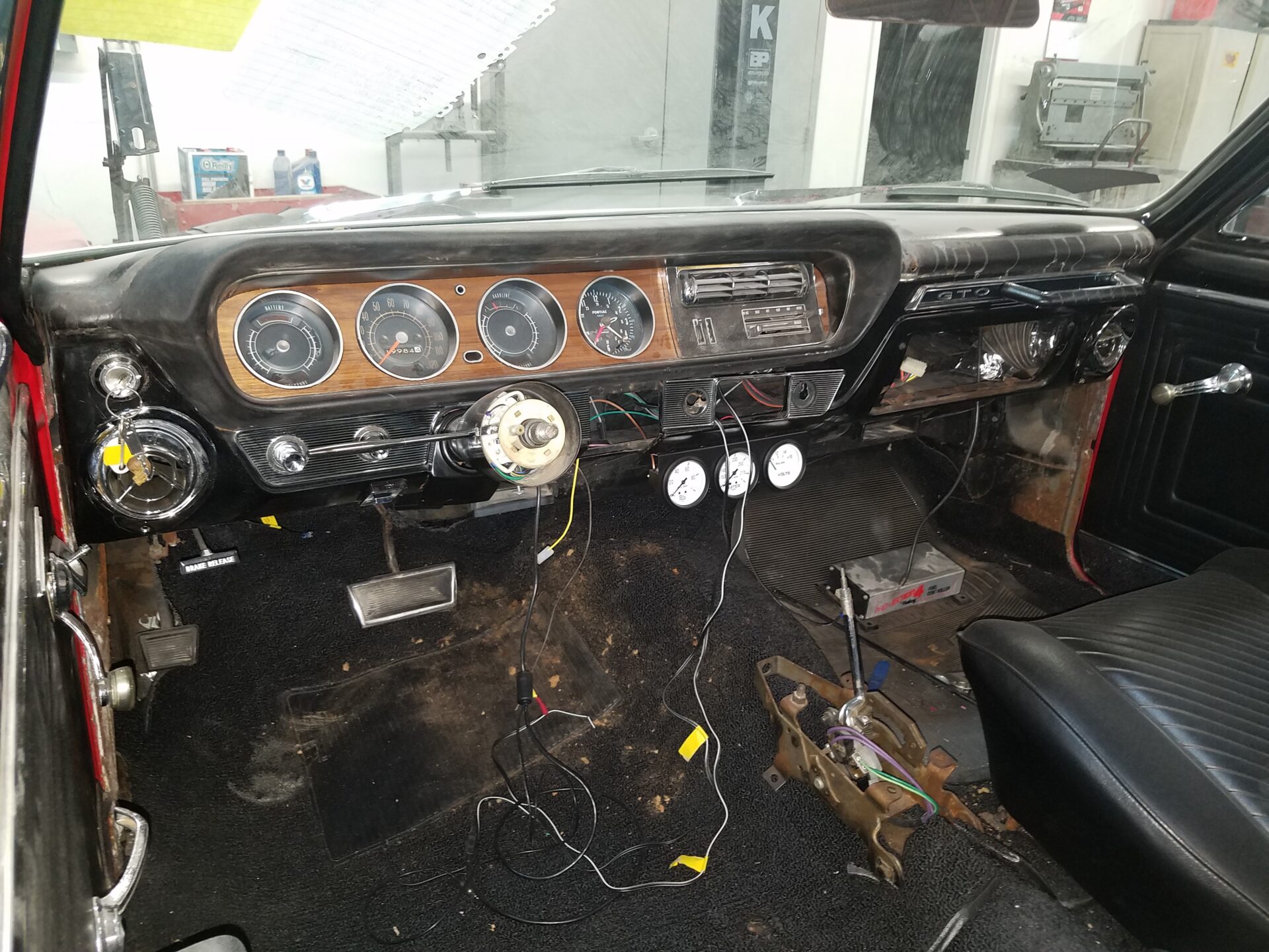 A 1965 Pontiac GTO without a steering wheel