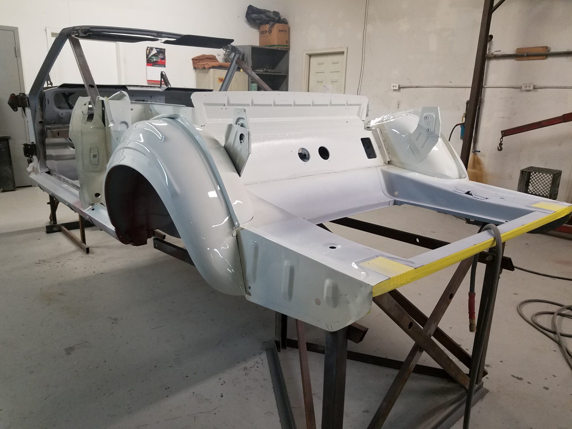 A partially restored 1966 Ford Mustang Convertible frame