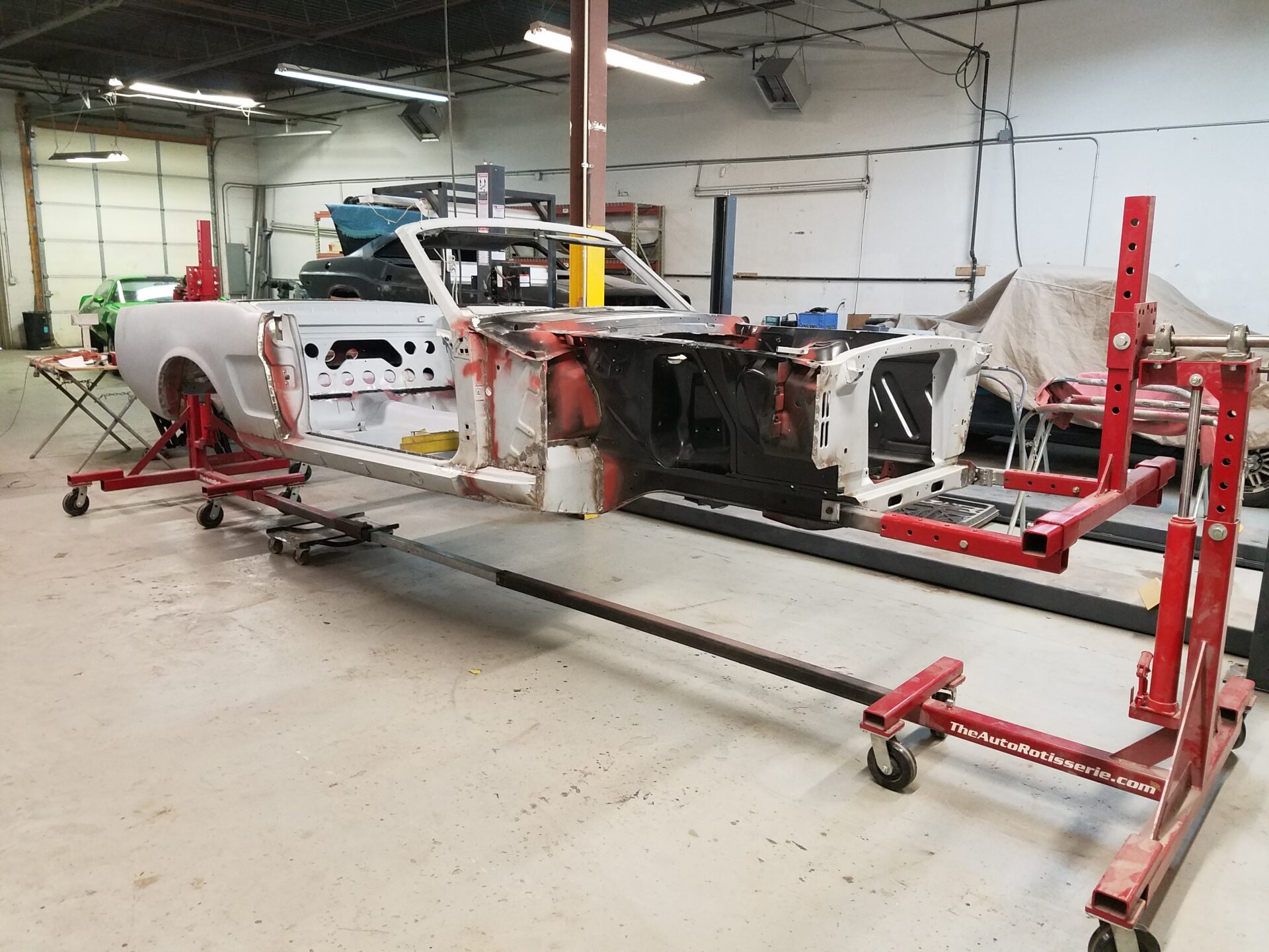 A partially assembled 1966 Ford Mustang Convertible frame