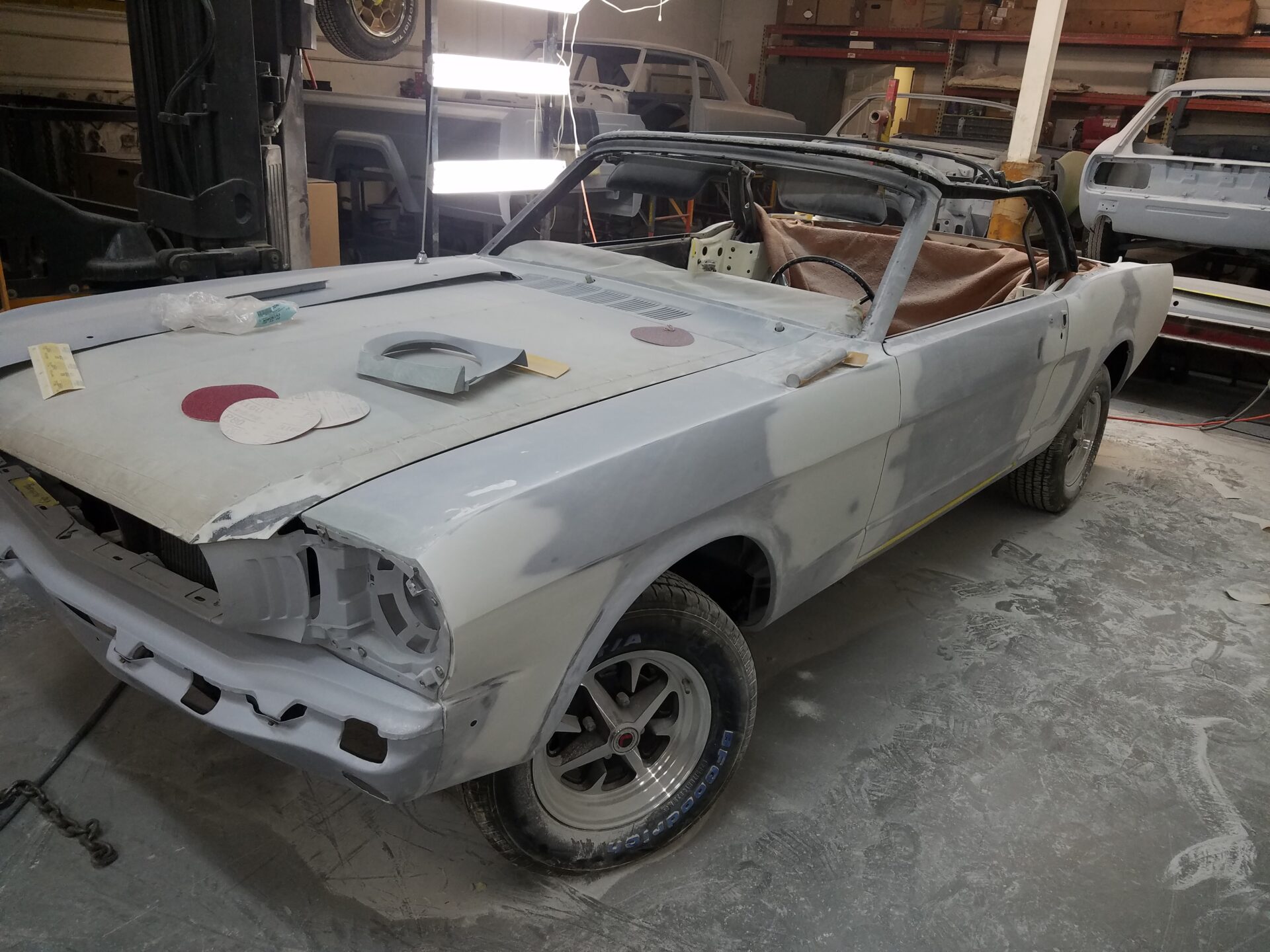 A front of the 1966 Ford Mustang Convertible painted in patches of white