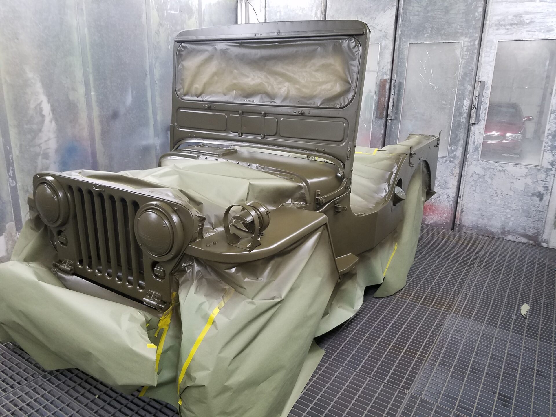 A partially painted 1951 military jeep model