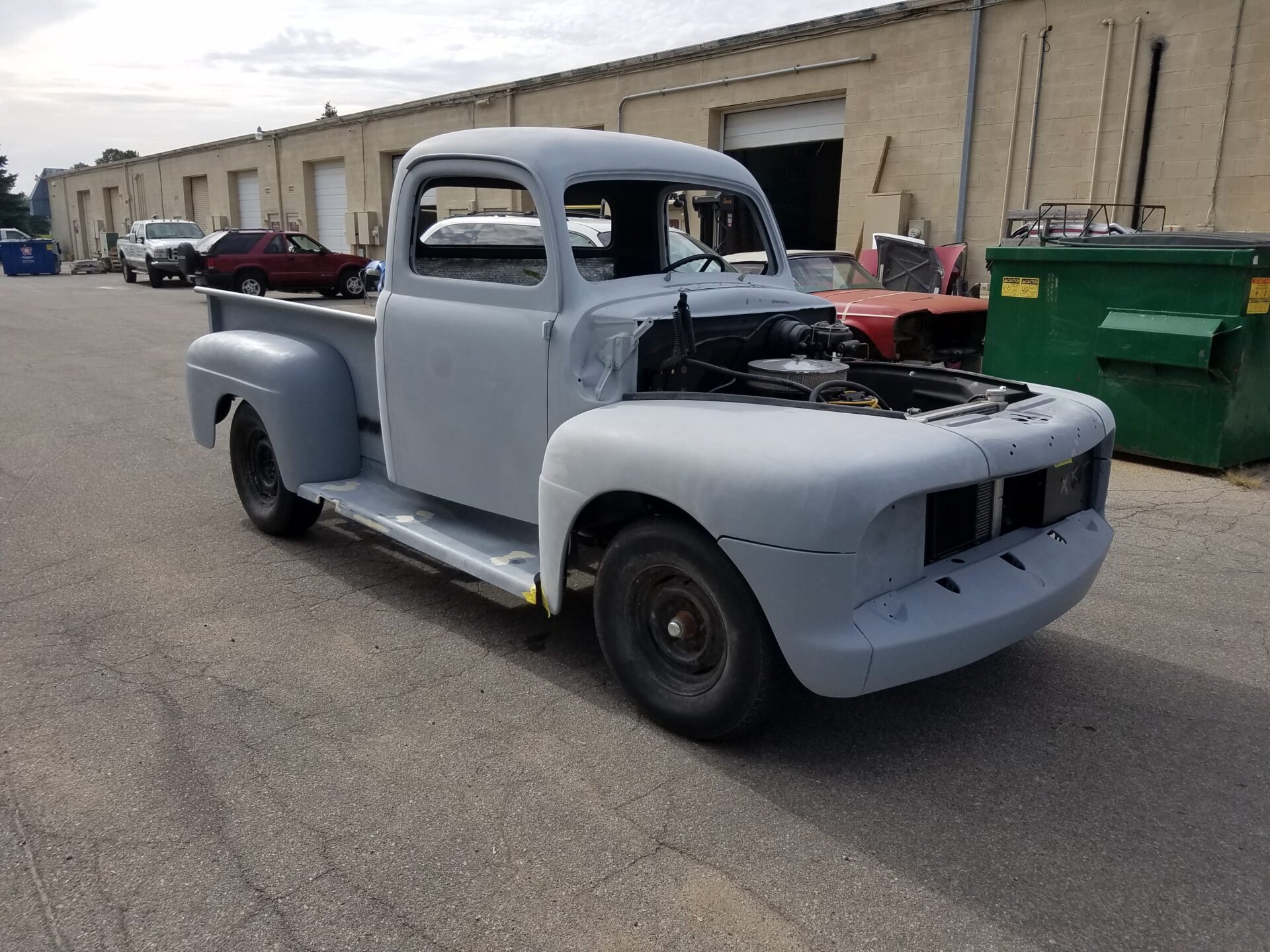 An unpainted 1952 Ford F100 model