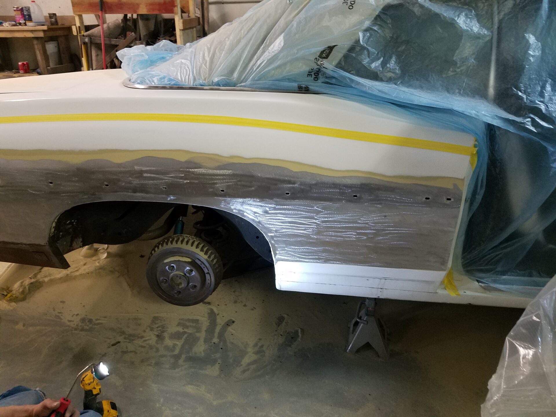 Removing the rusted and damaged part of the 1970 Pontiac Bonneville