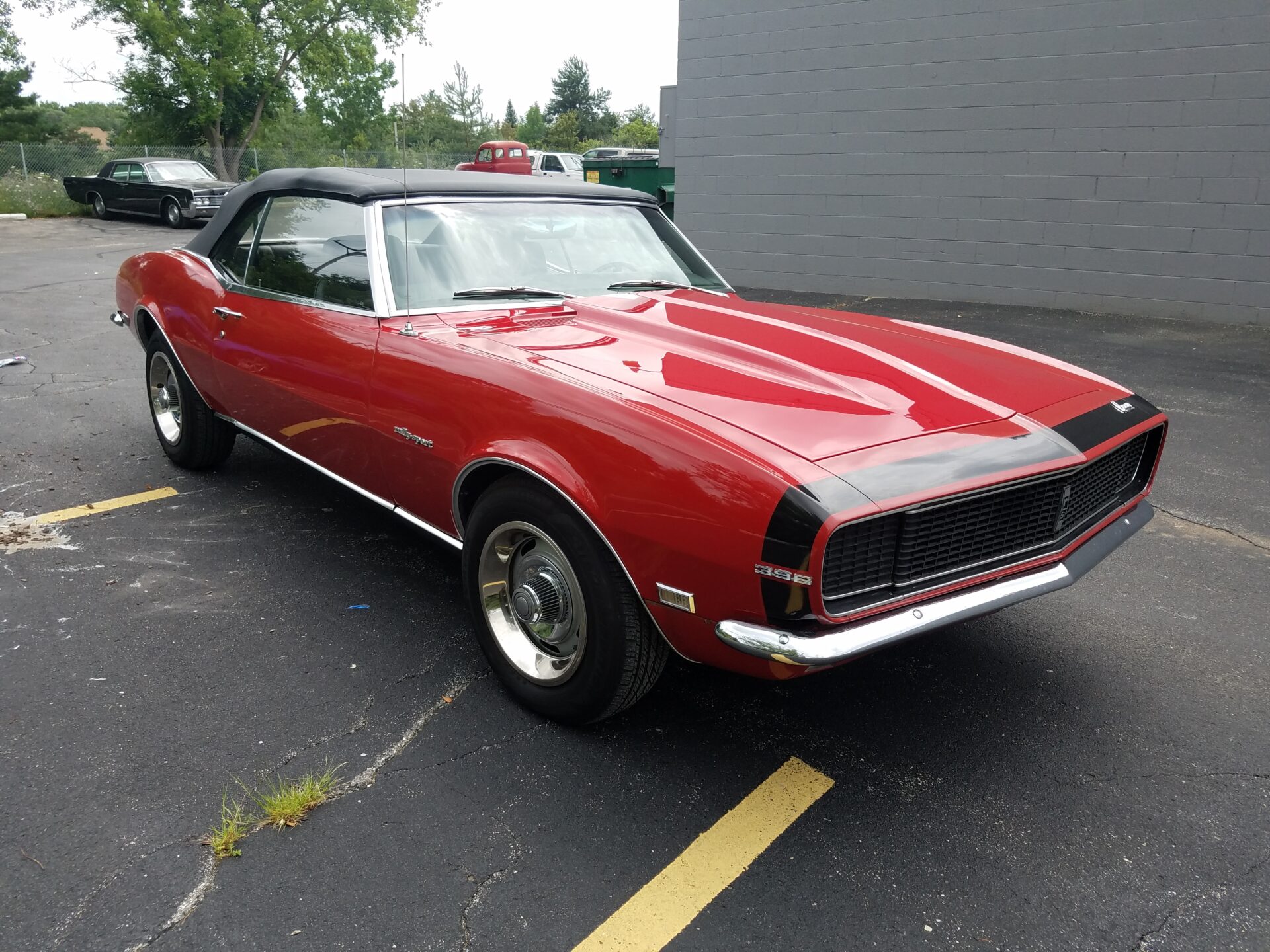 A red car with a black roof closer look