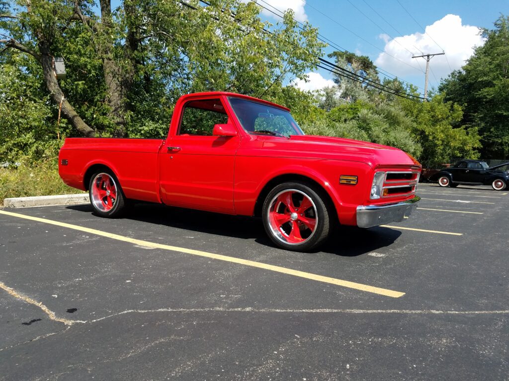 A fully restored 1968 Chevy C10 parked under the sun