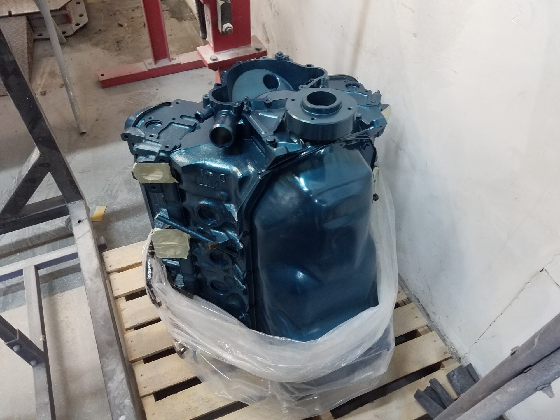 An engine part colored metallic blue