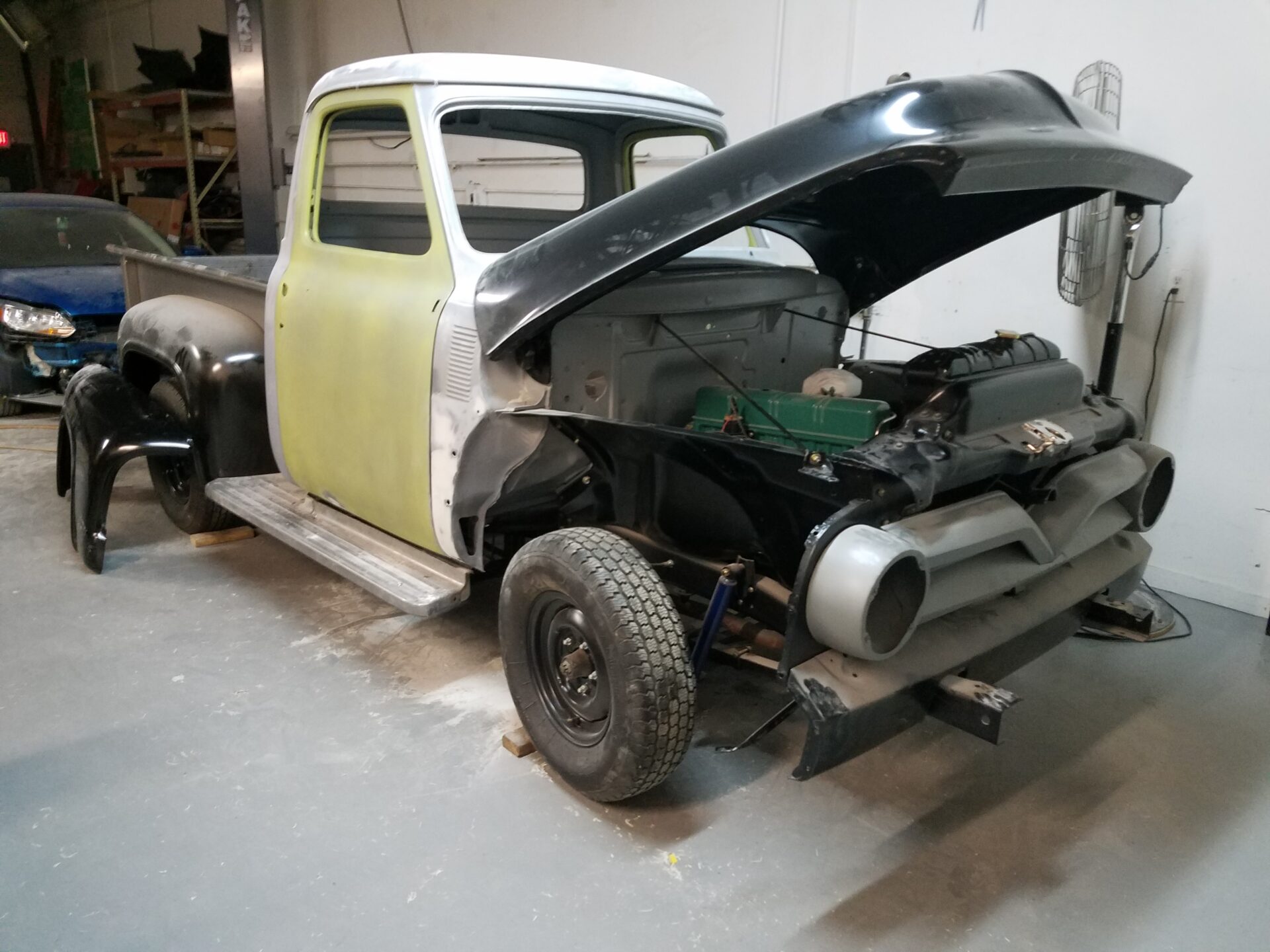 An open hood of the 1953 Ford F100